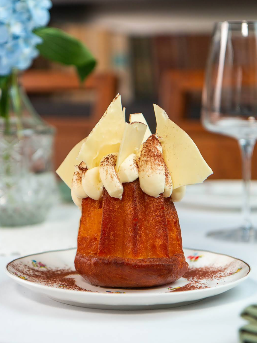 Rum Baba with cream and fruits