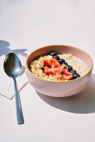 Oatmeal with almond milk, fruit, banana, granola