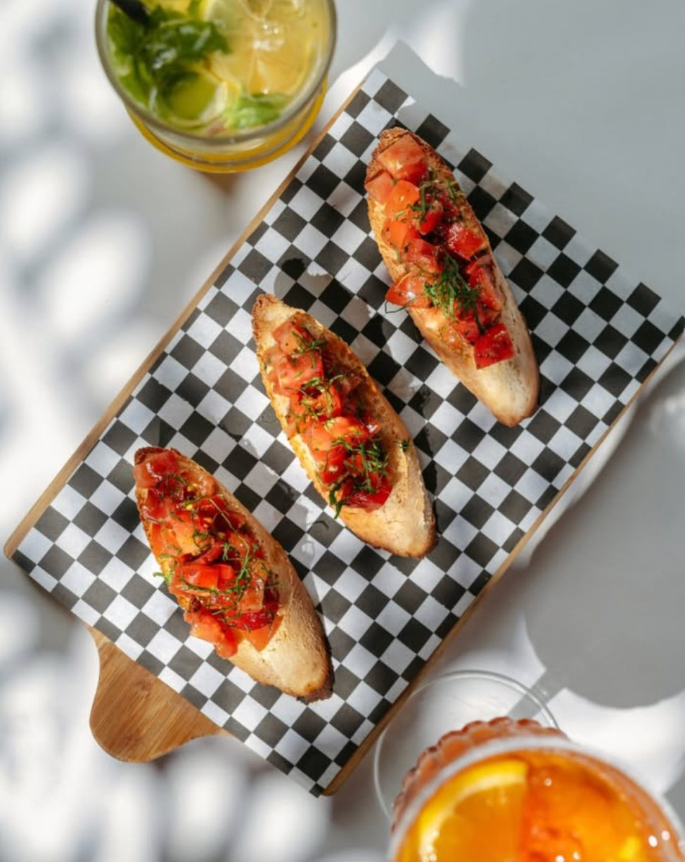 Toasted bread, sweet cherry tomatoes and basil pesto